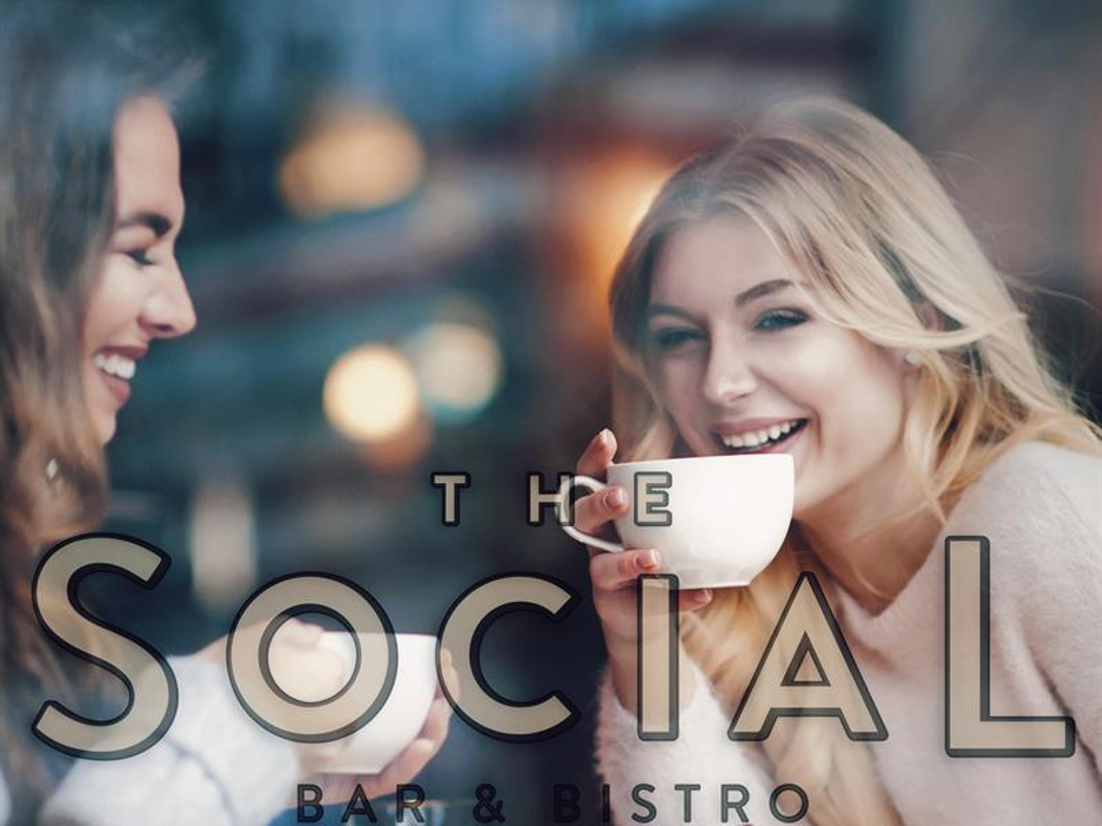 Two girls drinking coffee