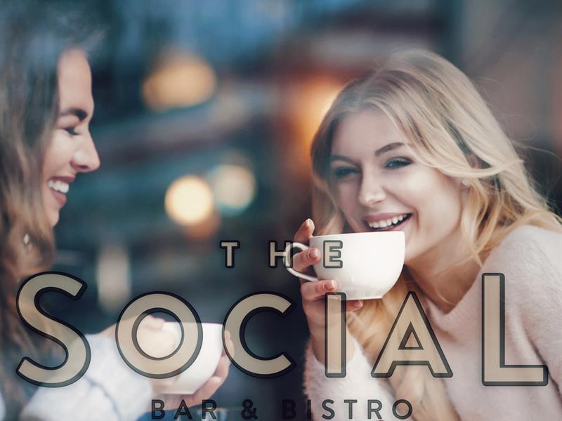 Two girls drinking coffee