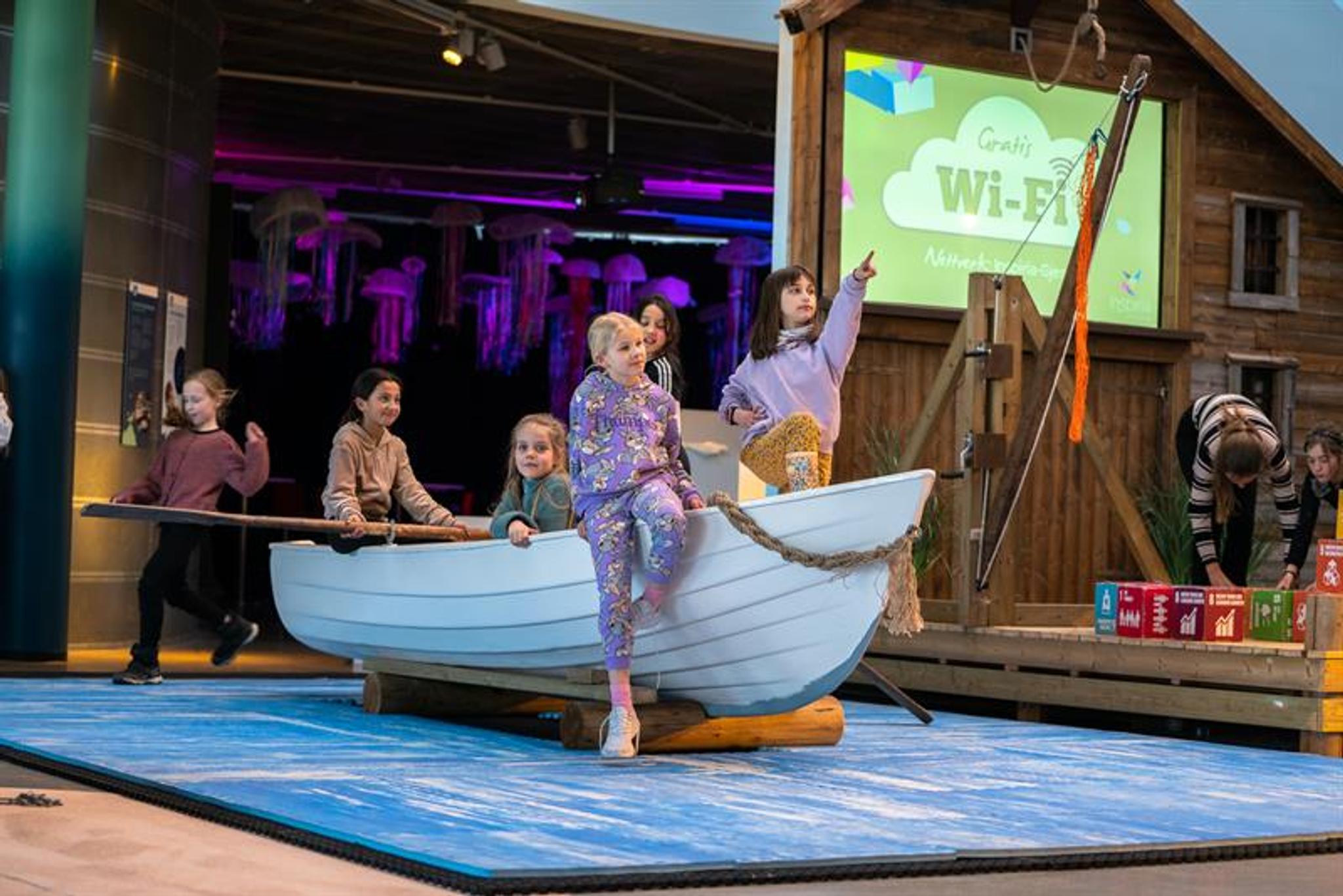 Children sitting in a rowboat