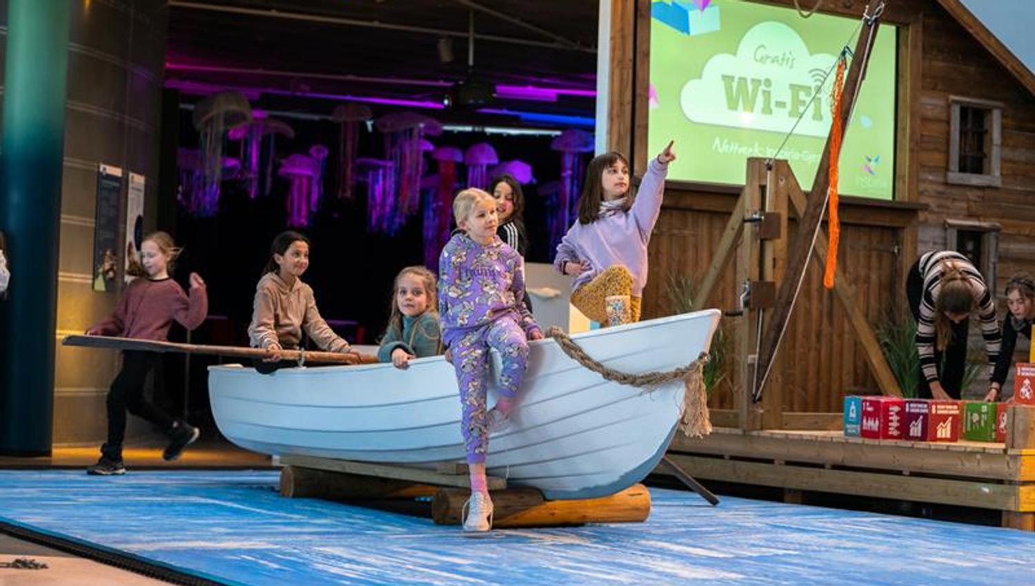 Children sitting in a rowboat