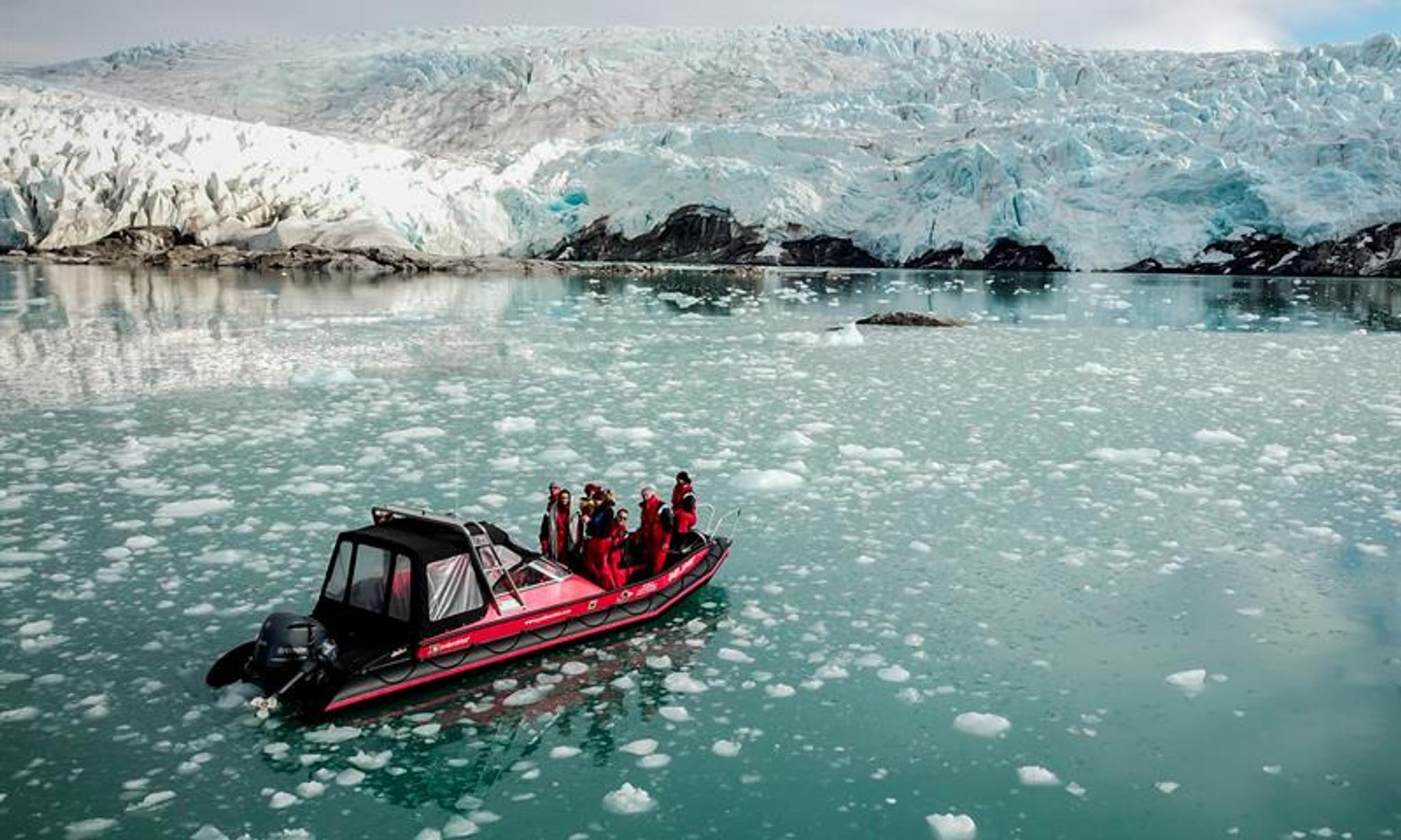 A RIB boat in front of the Nordenskiöld Glacier