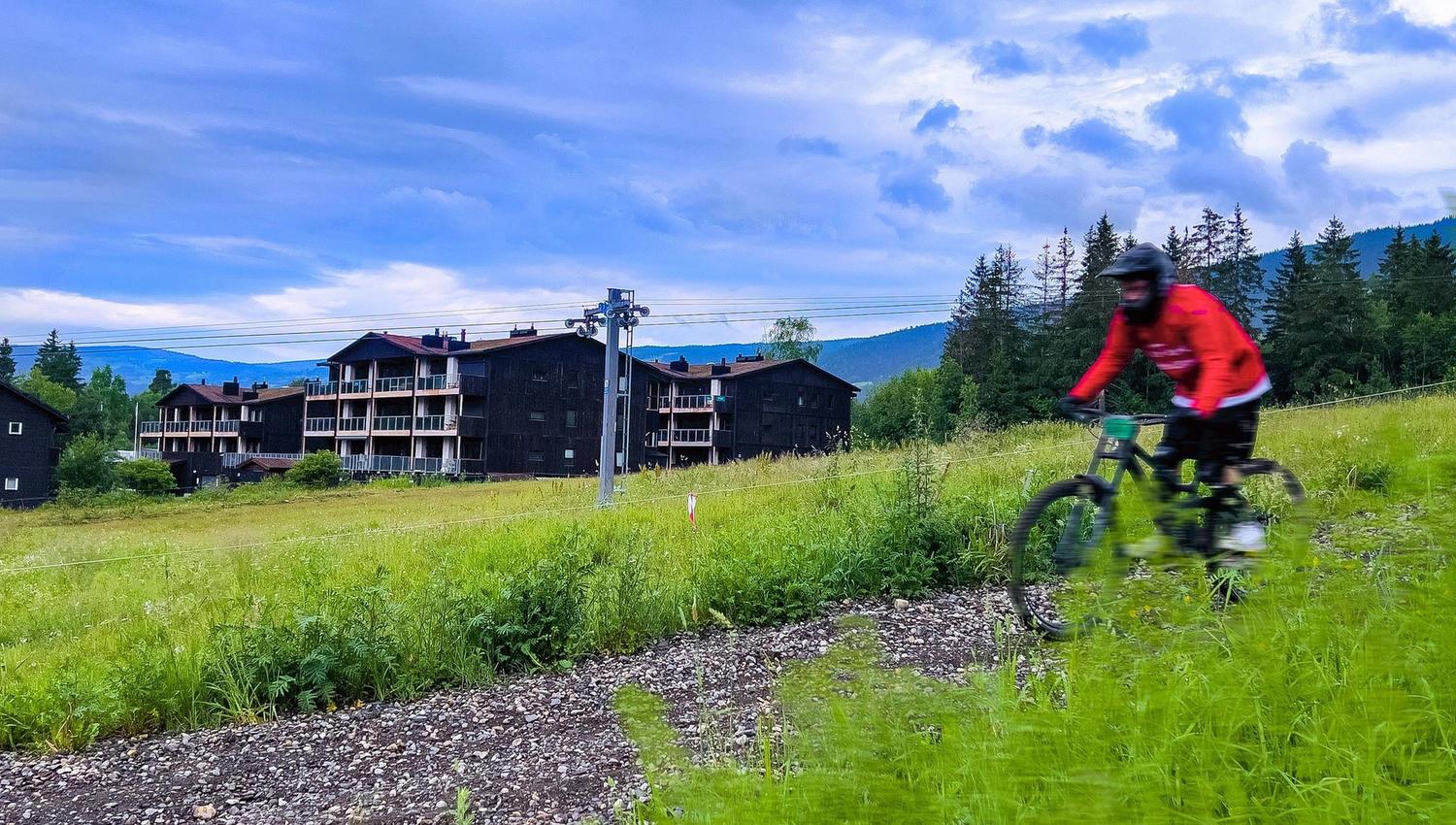 A person cycling on a trail in Hafjell Bike Park