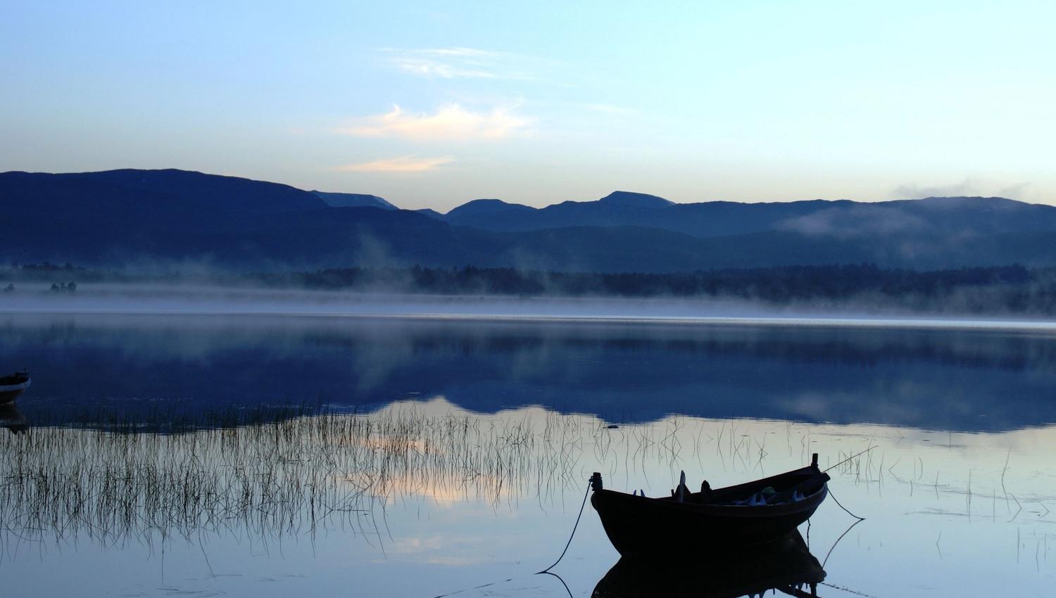 a lake with a boat