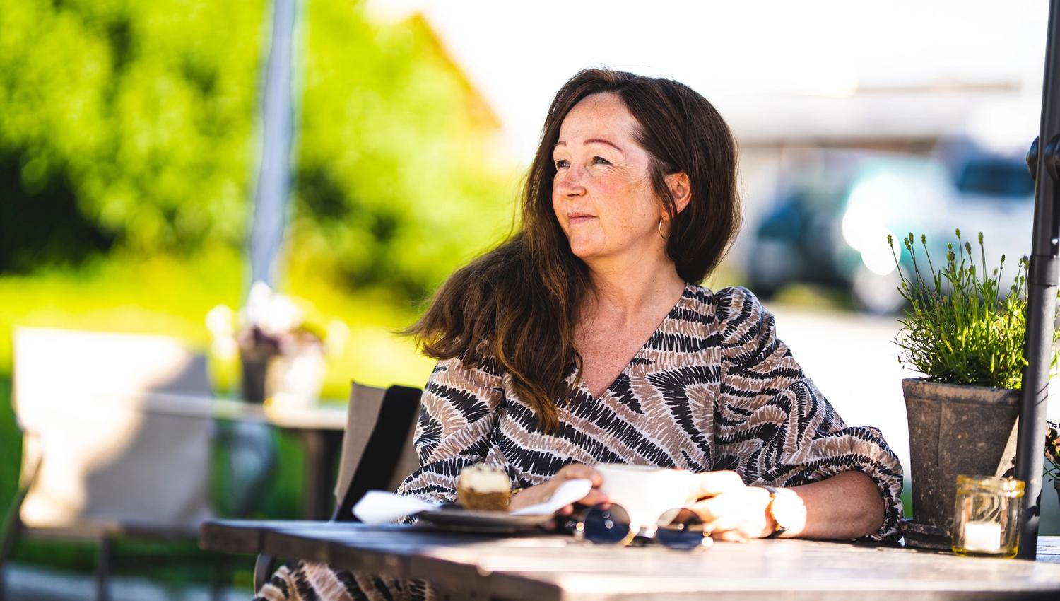 woman sitting at a cafe