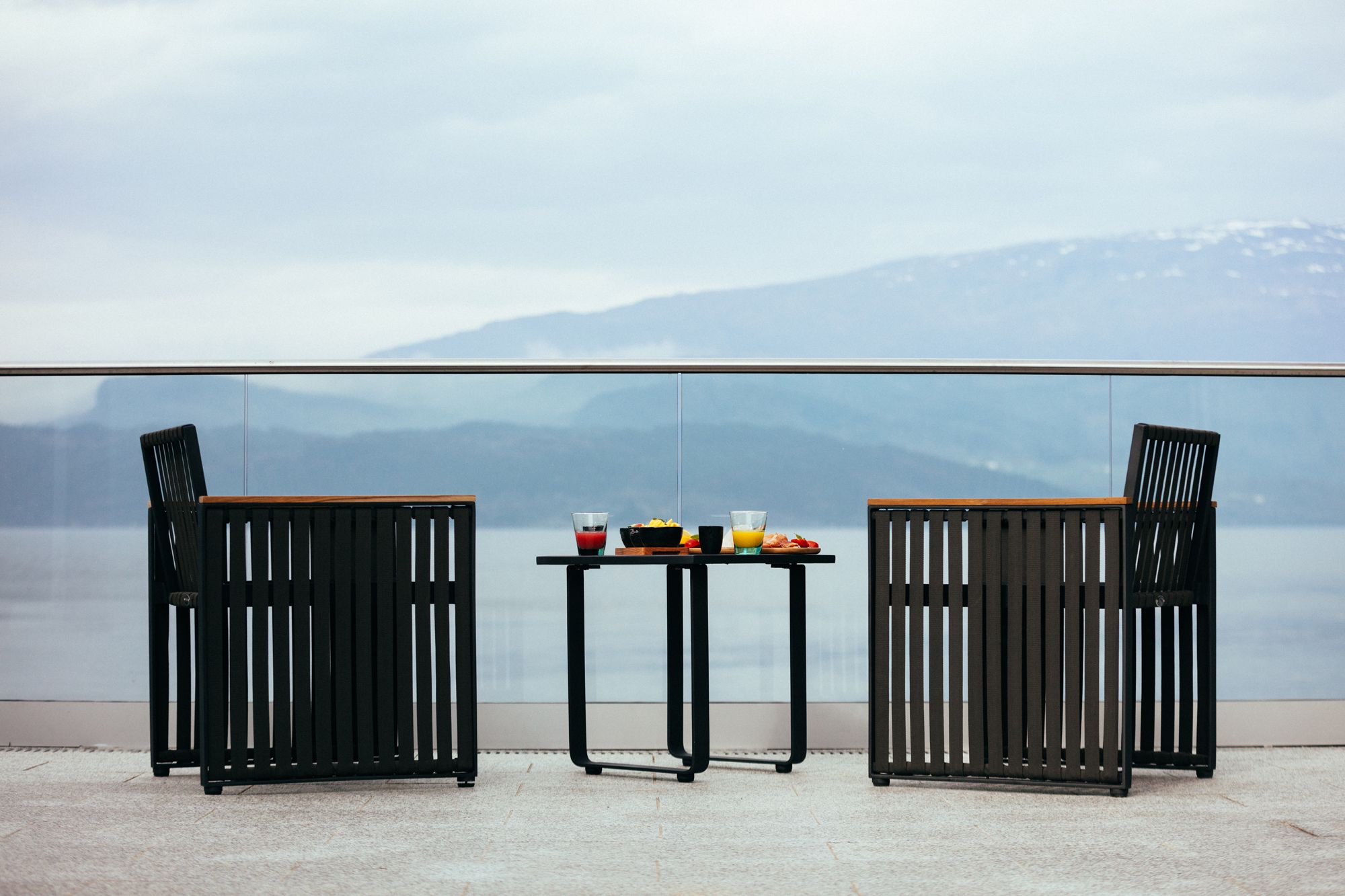 Comfortable outdoor seating on the terrace with a stunning fjord view.