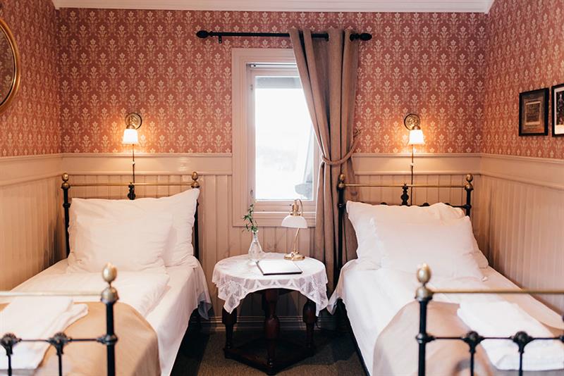 bedroom with 2 beds at Tuddal Høyfjellshotel 