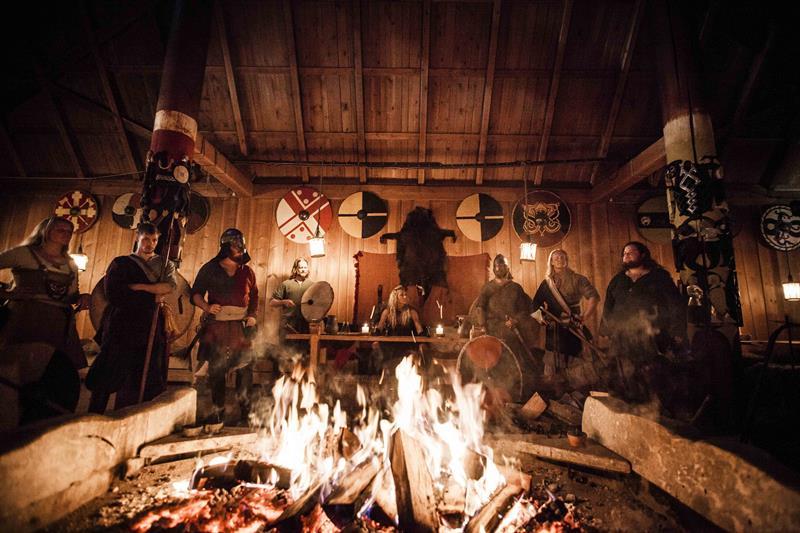 Party around a fire, in Viking costume
