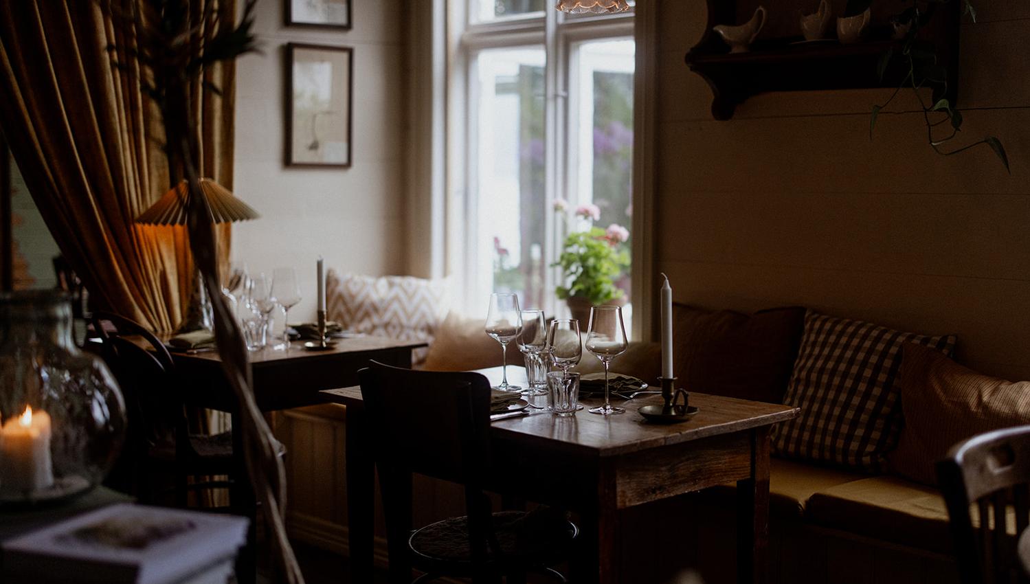 Charming dining spot at Hotel Sundal – offering a cozy vibe and views of the fjord garden.