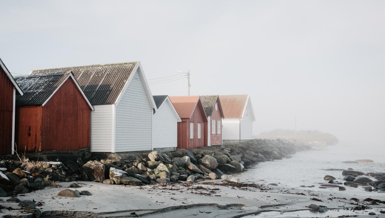 The iconic sea houses at Ølberg - here fog-covered
