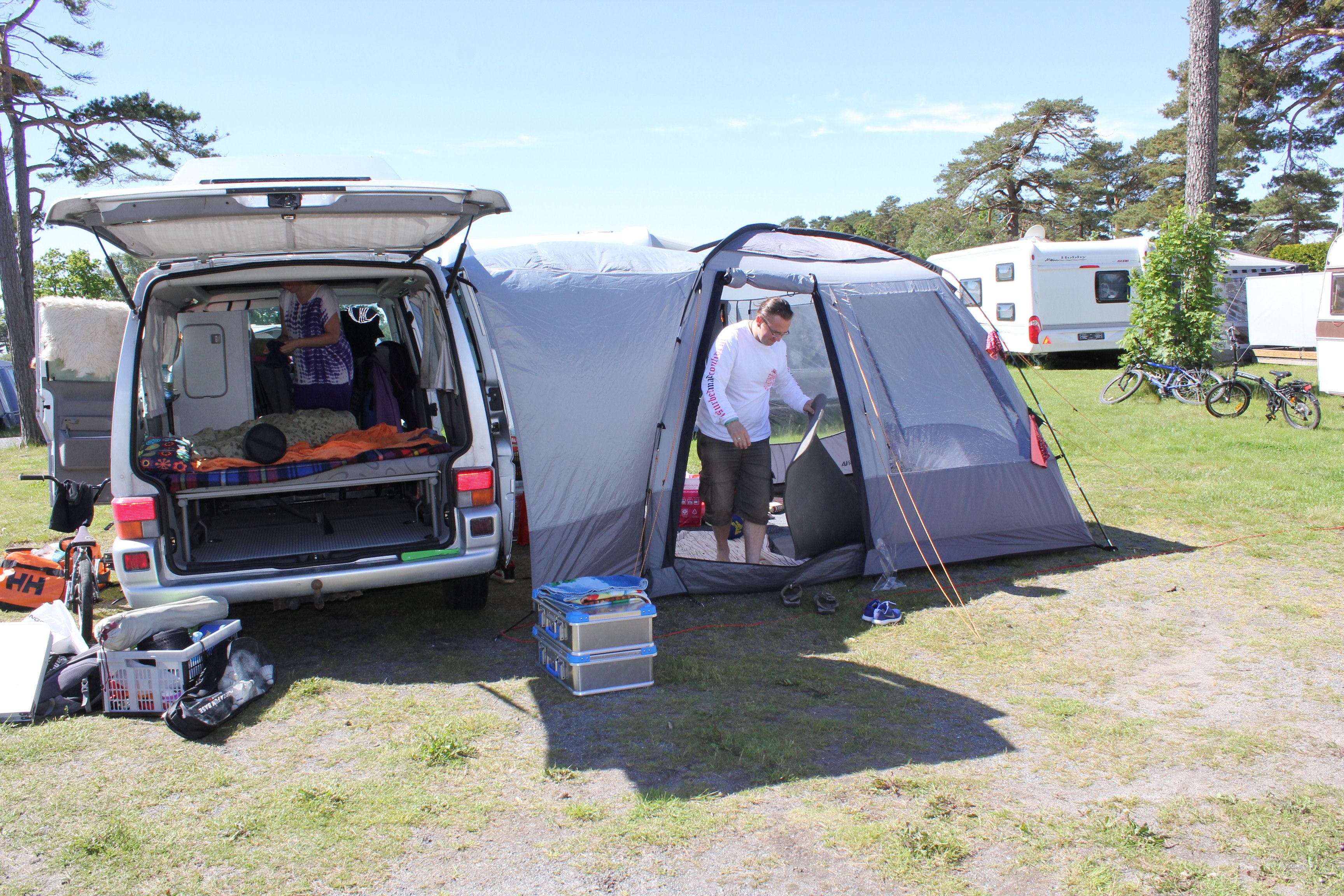 A man set up a tent next to his car