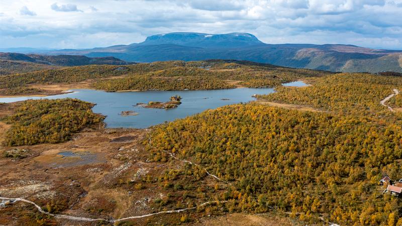 A small lake next to Hakkesetstølen, behind is Hallingskarvet national park, drone picture