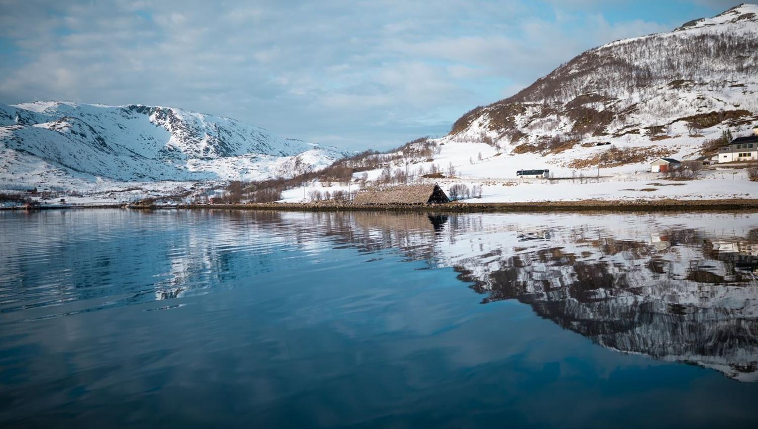 View of the fjord and snow covered mountains