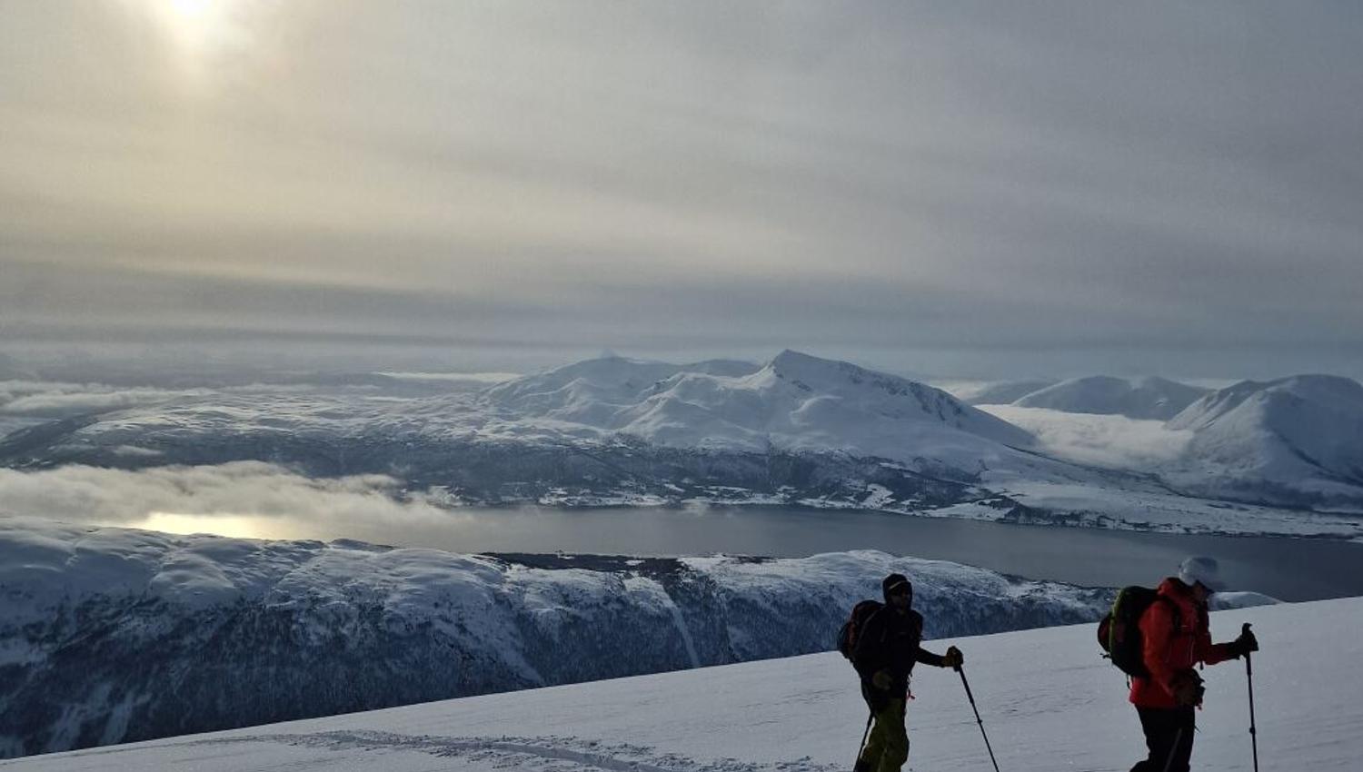 View from the top of the hill, the sun shining overhead.