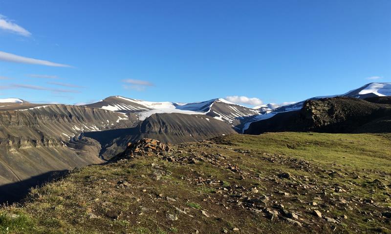 view from top of the mountain with the glaciers in the background 