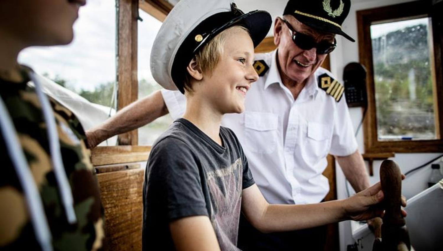 boy with captain on MS Fram
