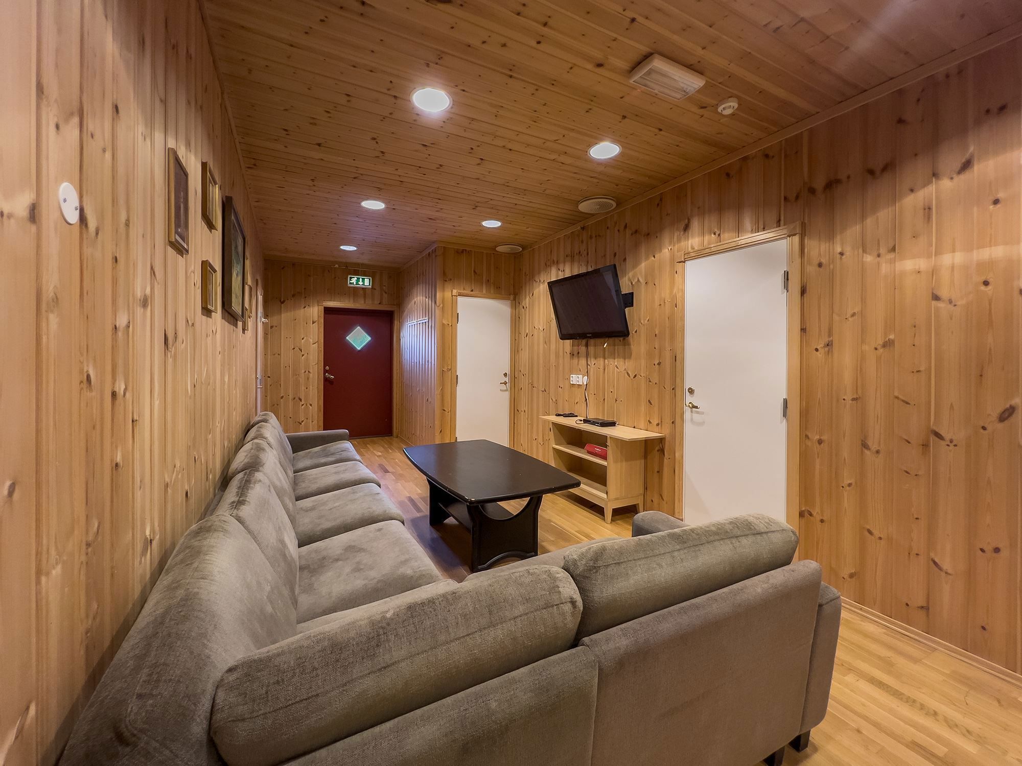 TV room with sofas and a table.