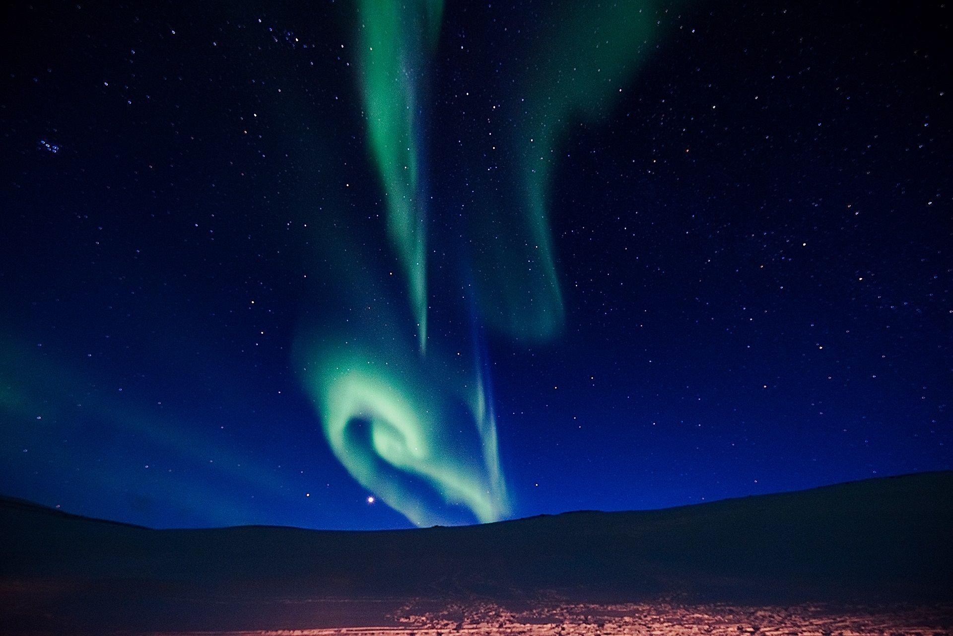 Northern lights shining far away in the skies