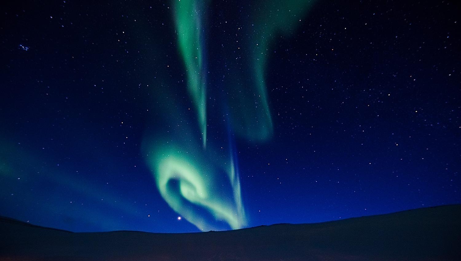 Northern lights shining far away in the skies