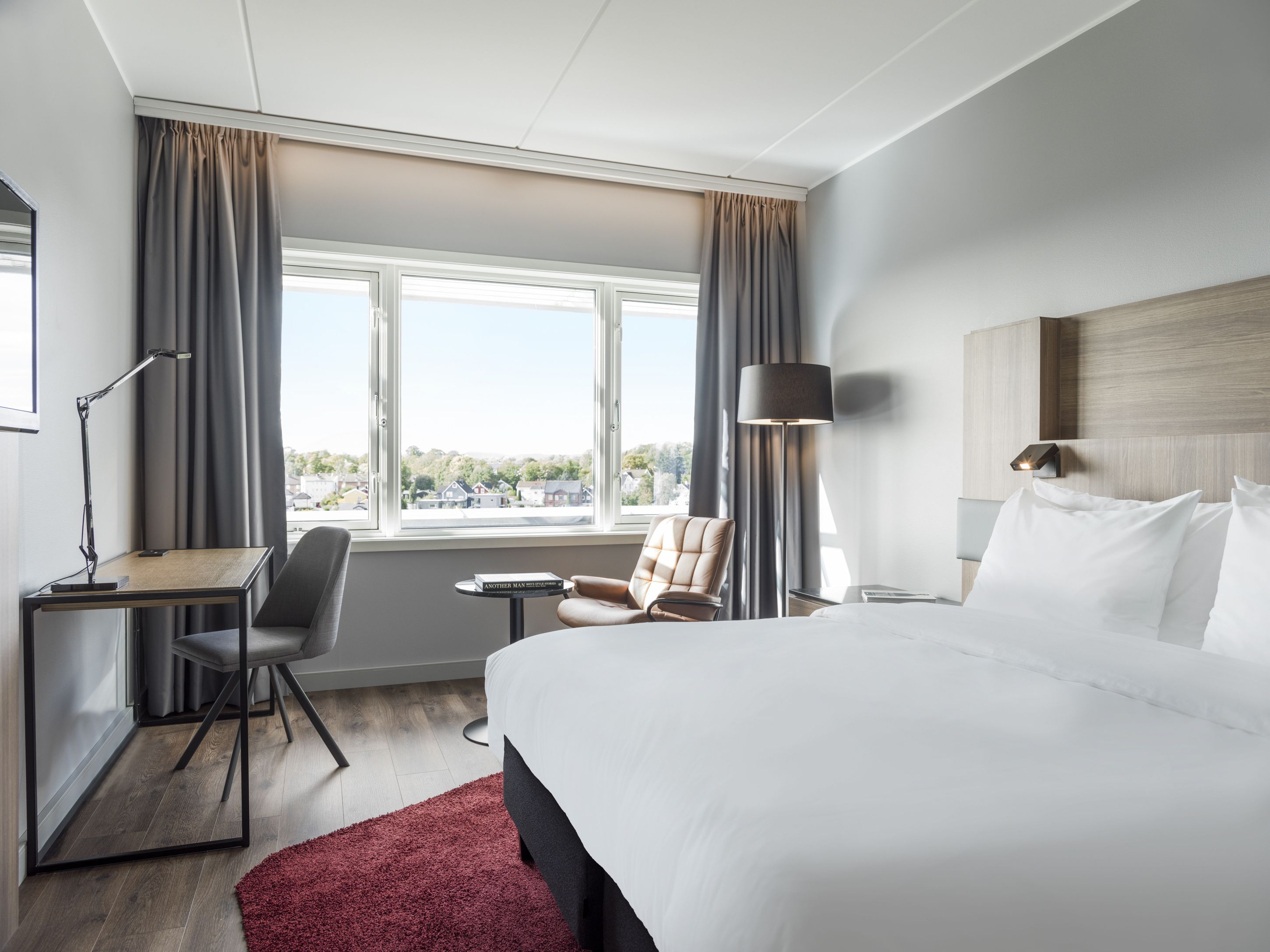 Guest room with light and minimalist decor. Room with a view. Photo