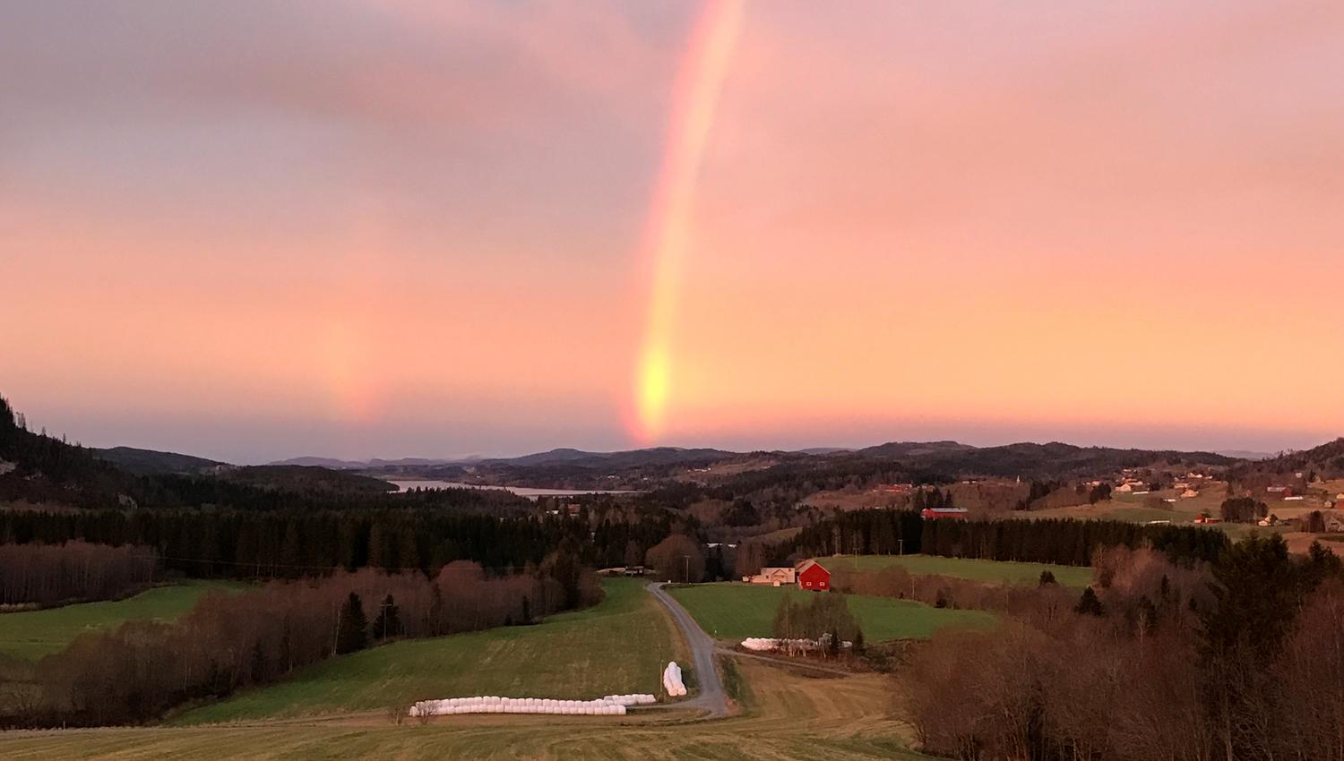 Troset in Levanger Municipality: View from the farm with sunset and rainbow