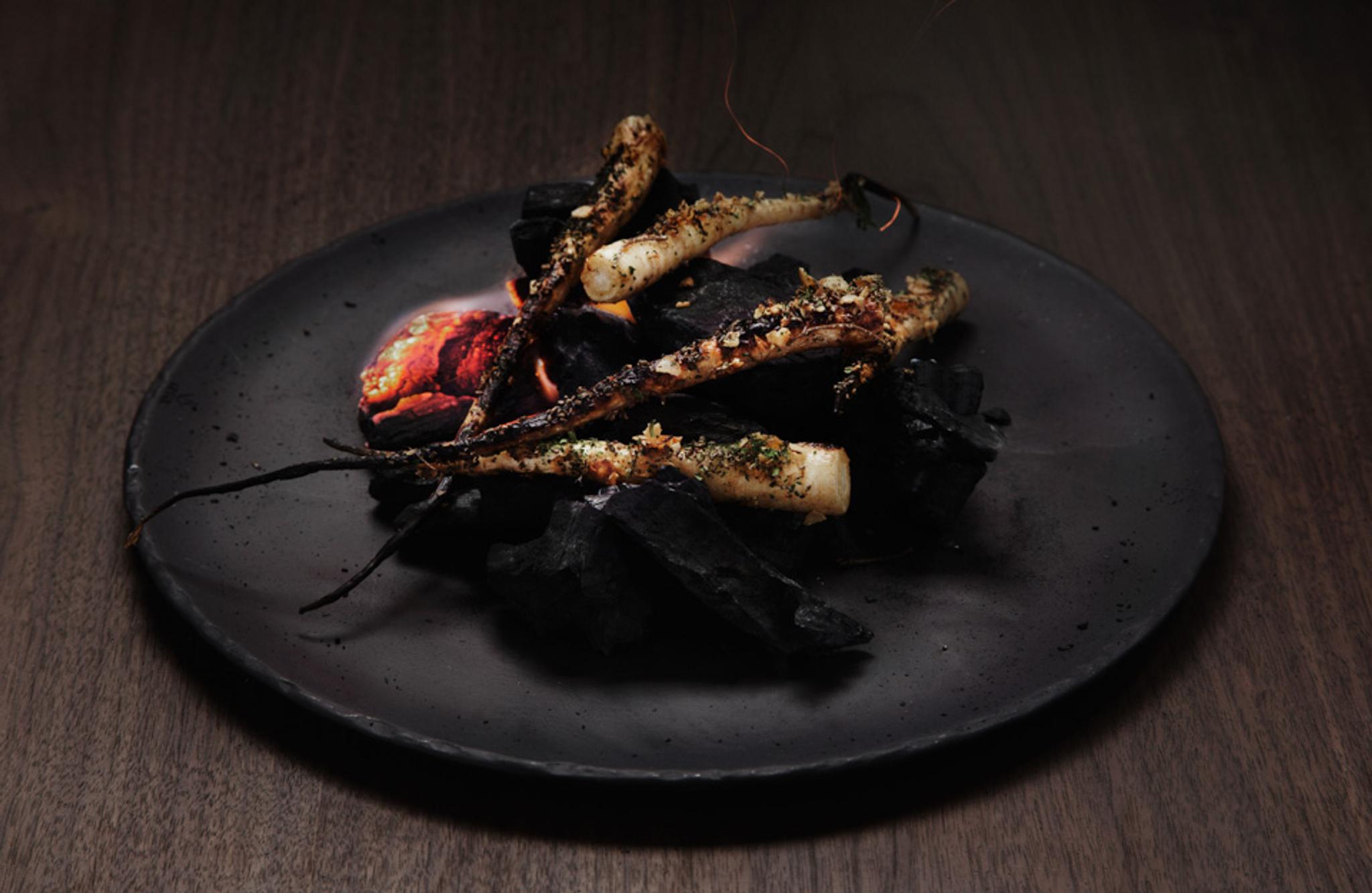 Detail photo of a dish on a black plate.