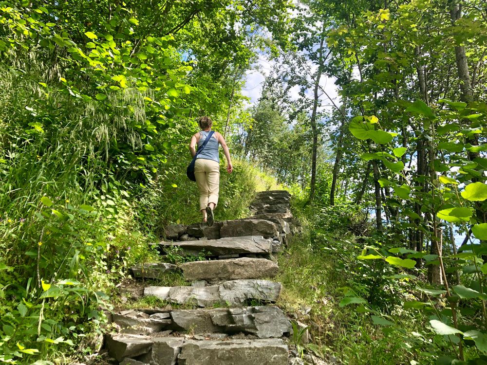 lady walking up the Sherpa steps to Rui Square