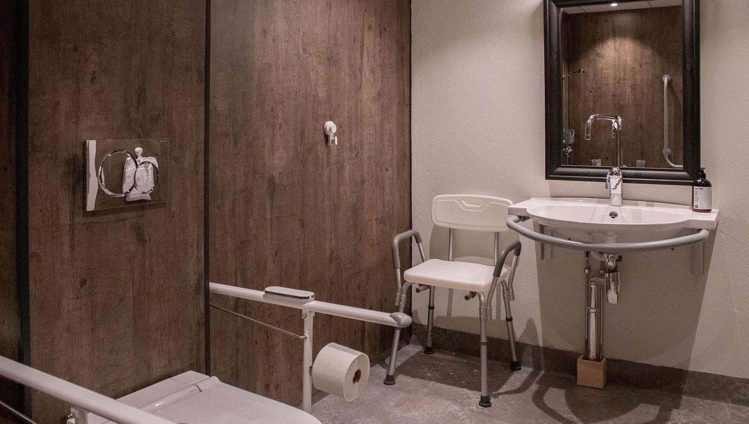 A bathroom with sink and toilet.