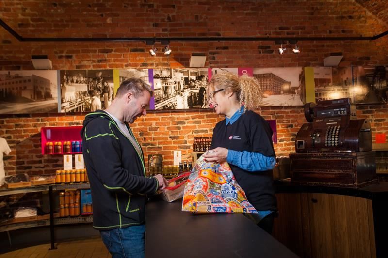 a man is buying beer in the beer shop