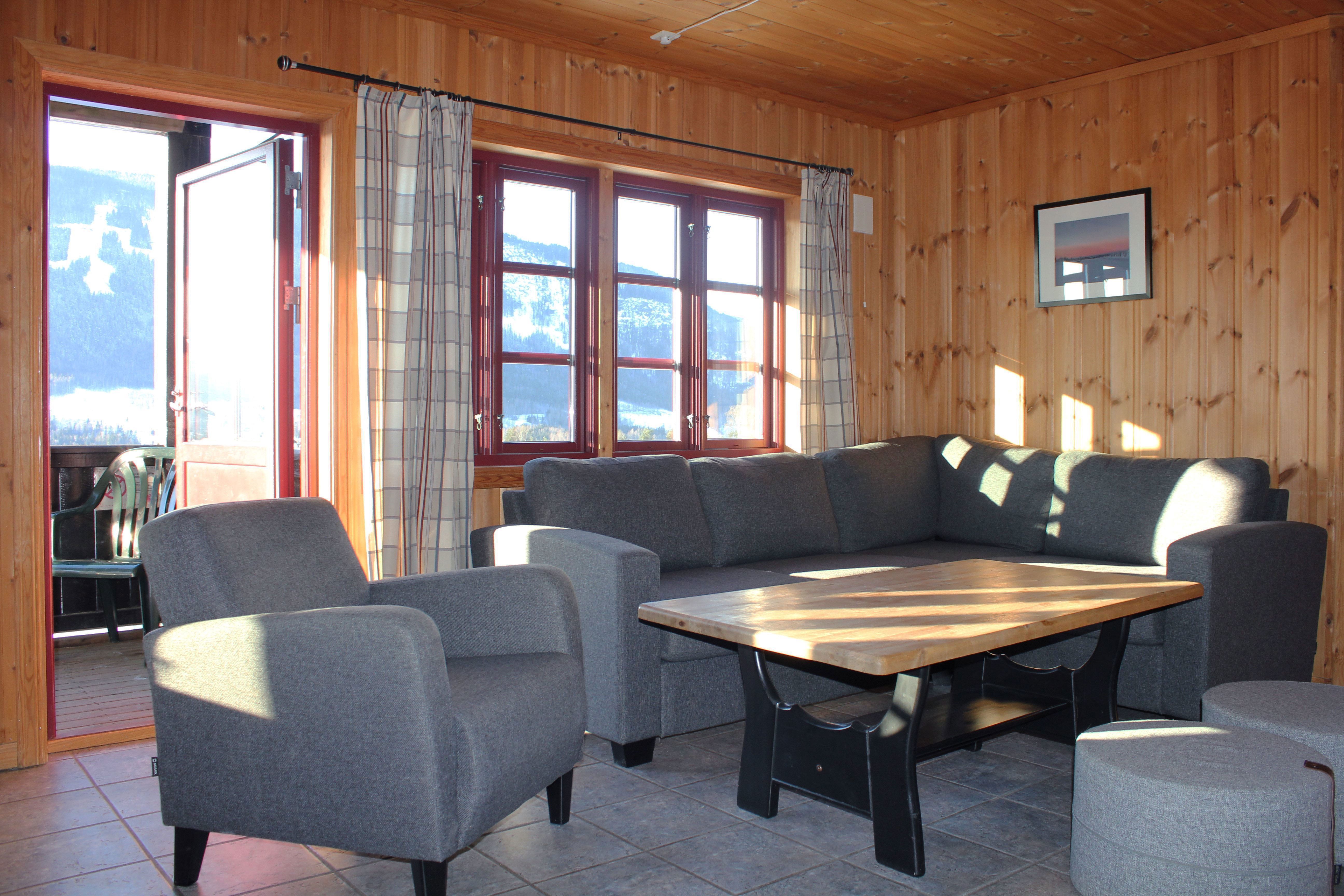 A sofa and a table in a room.