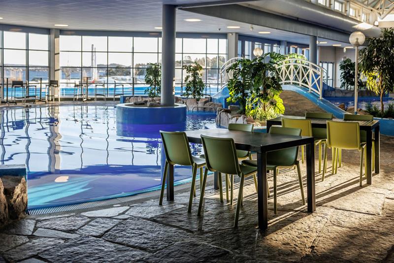 lounge with dining areas in the water park in Langesund