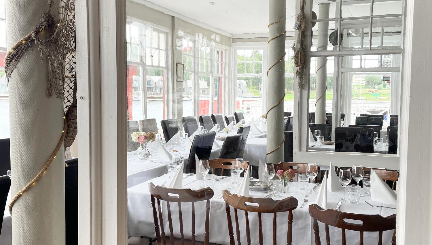 Close-up of the bright restaurant interior, featuring white details.