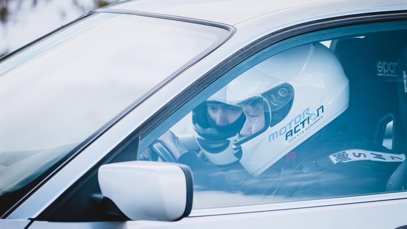Two drivers are  sitting in the car during an extreme rally experience