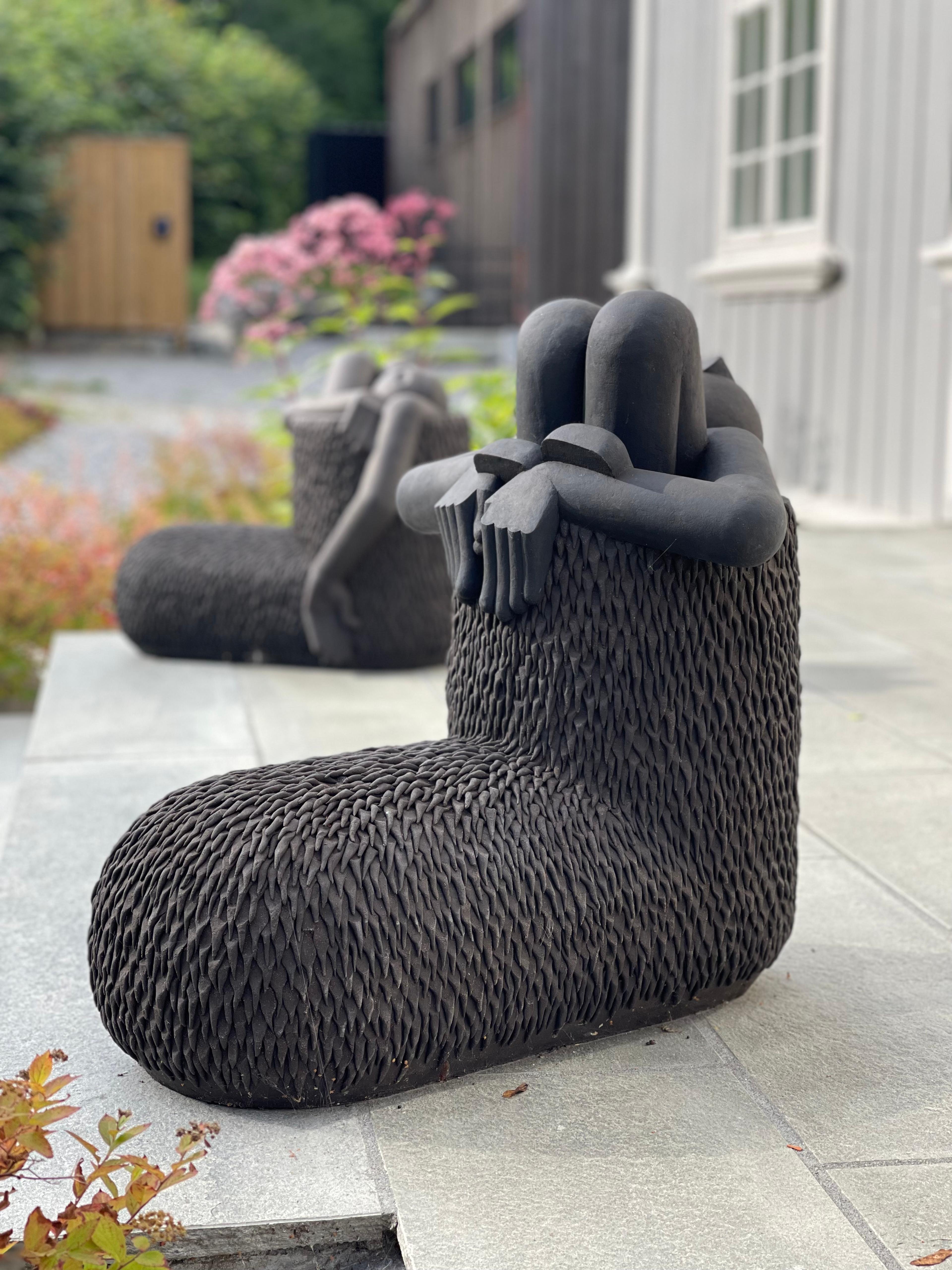 Black sculpture looing like boots