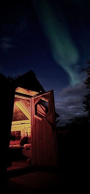 Open cabin and northern lights