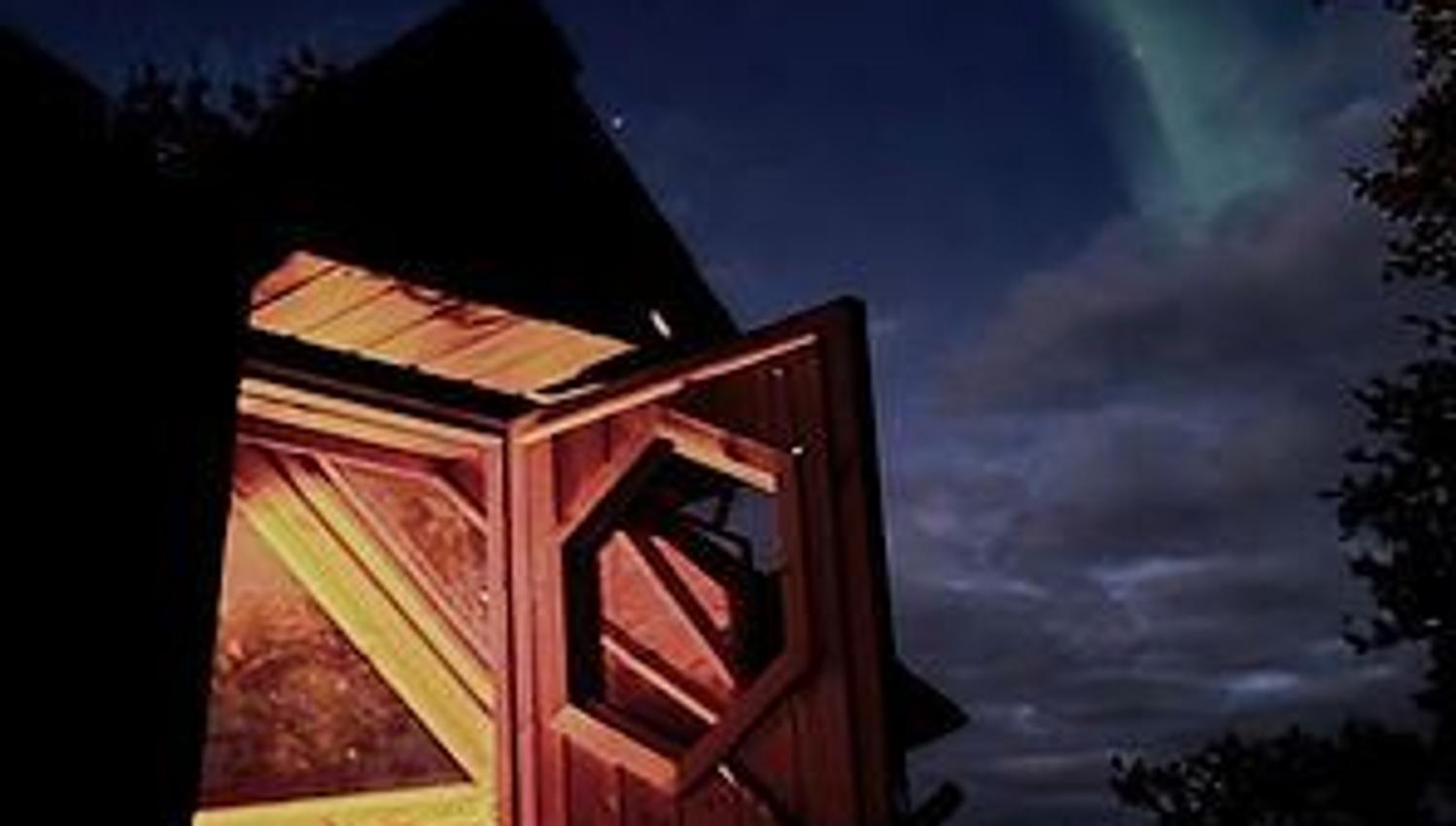 Open cabin and northern lights