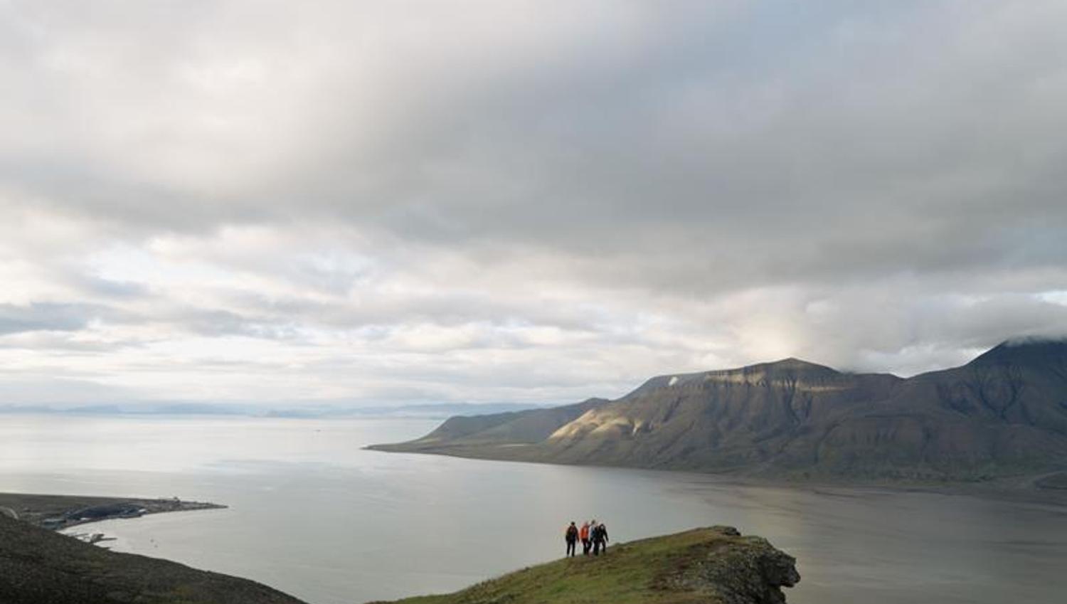 persons hiking in the mountain