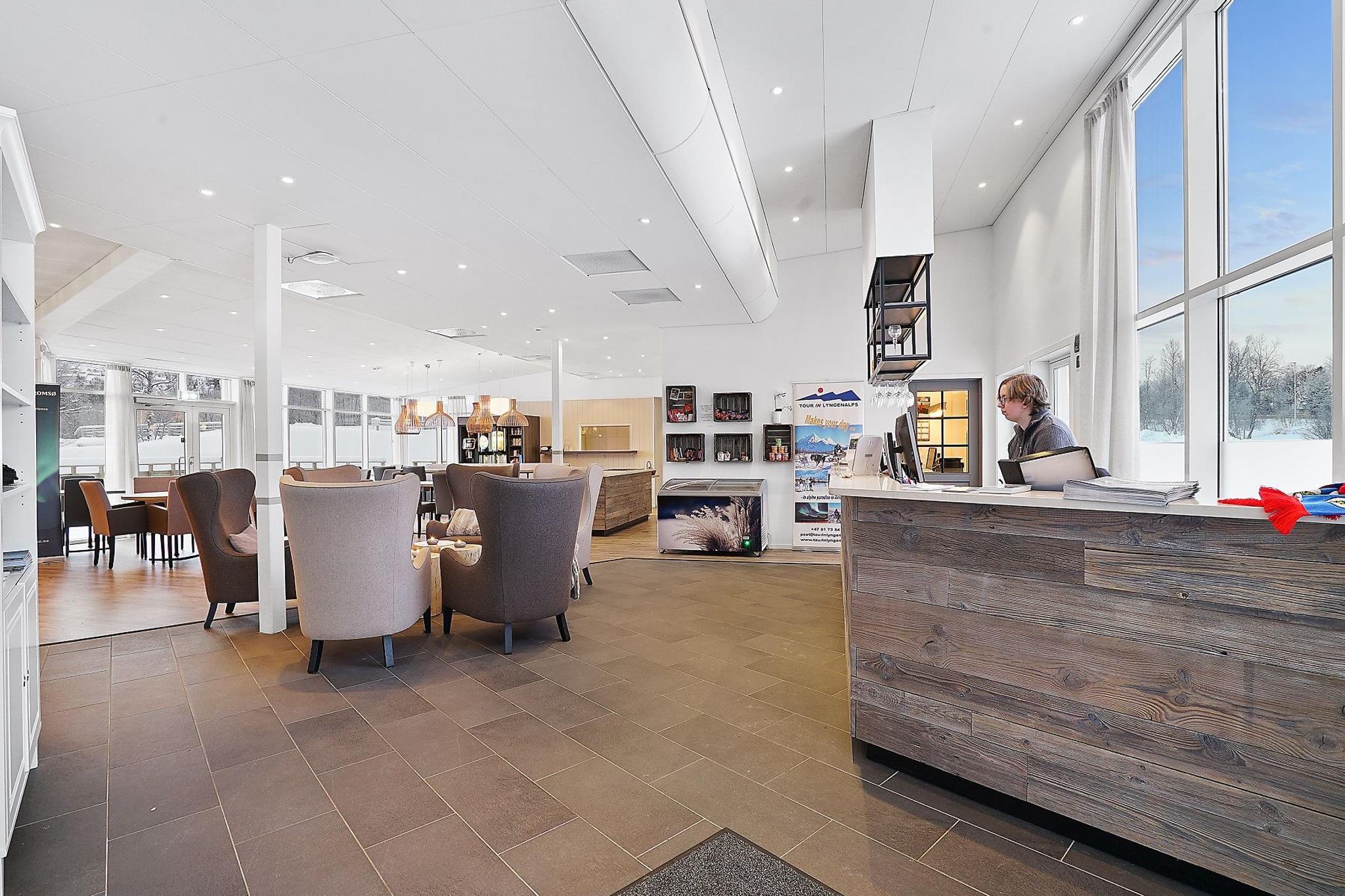 Modern reception area with seating and large windows