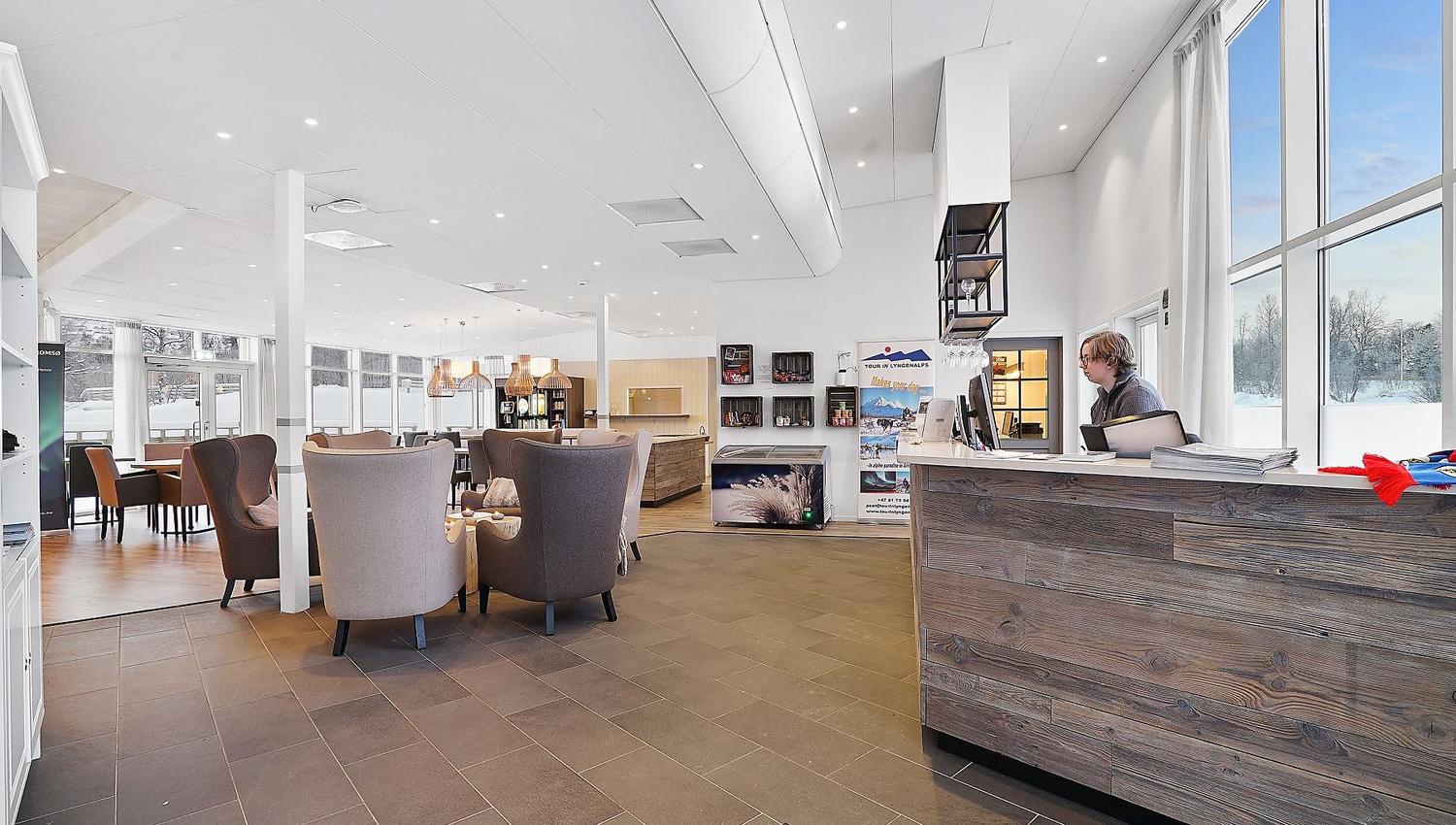 Modern reception area with seating and large windows