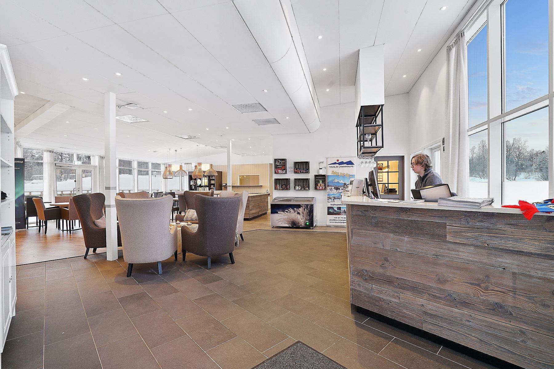 Modern reception area with seating and large windows