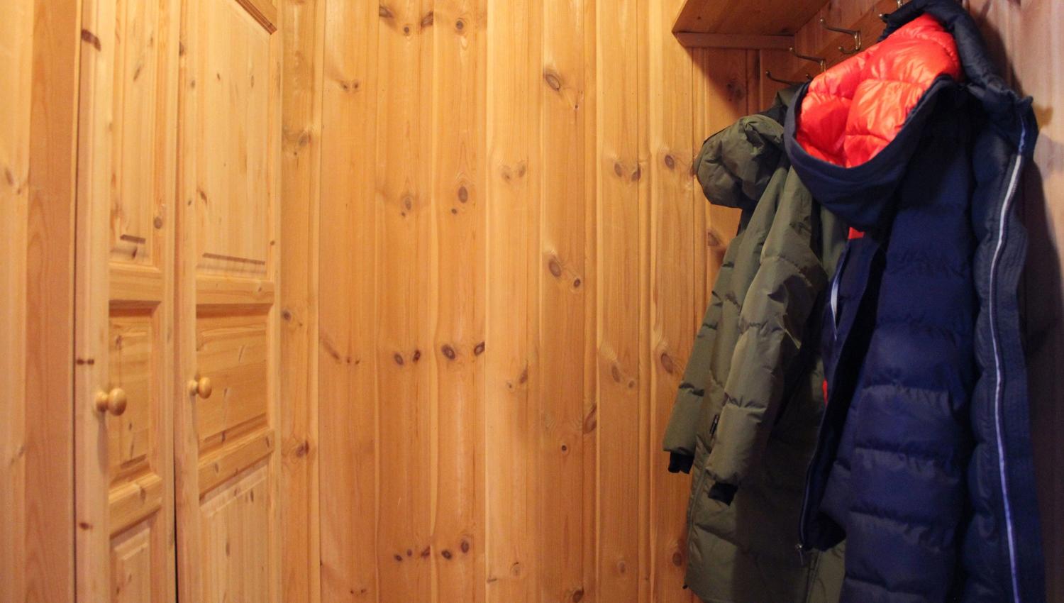 A clothes rack in a room.