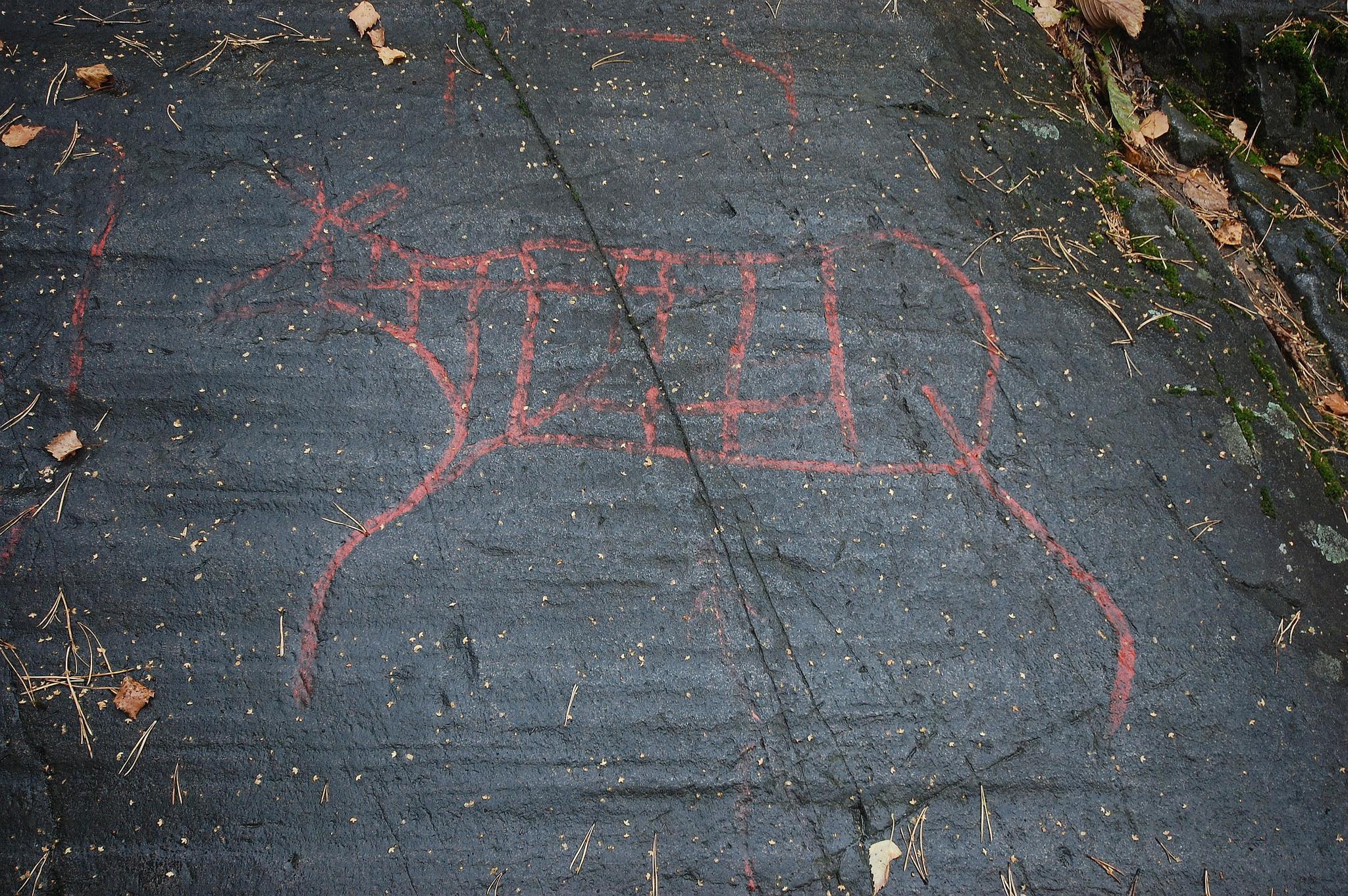Photo of petroglyphs on a rock.