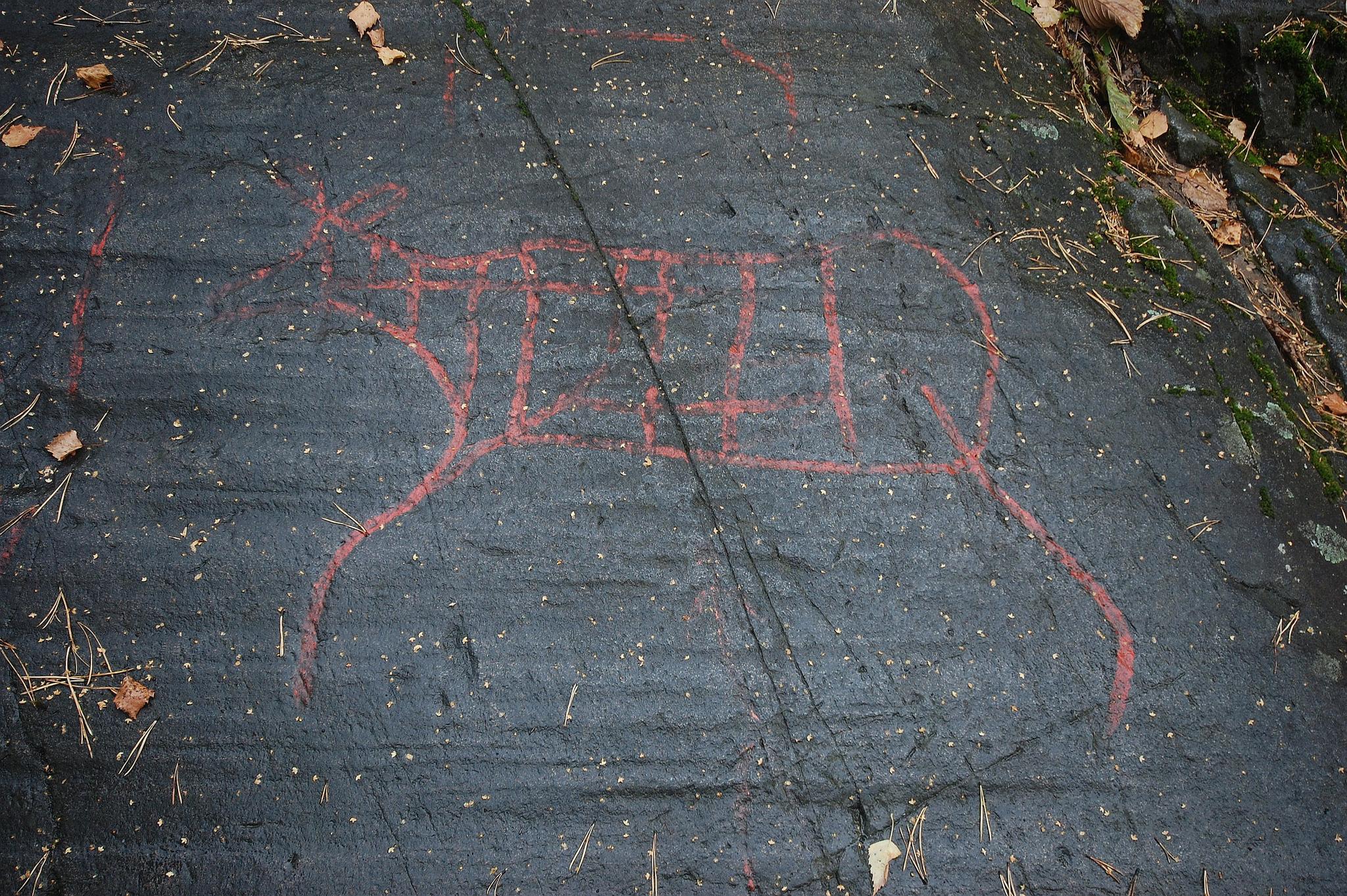 Photo of petroglyphs on a rock.