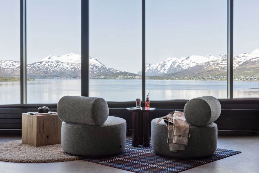 View over the sea and mountains inside the lounge at Moxy hotel.