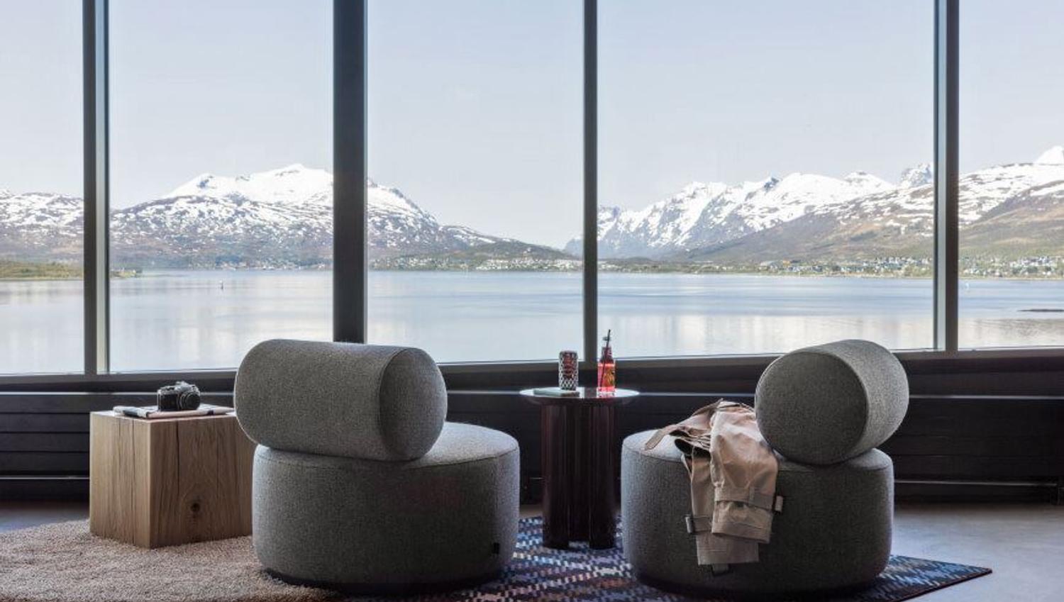 View over the sea and mountains inside the lounge at Moxy hotel.