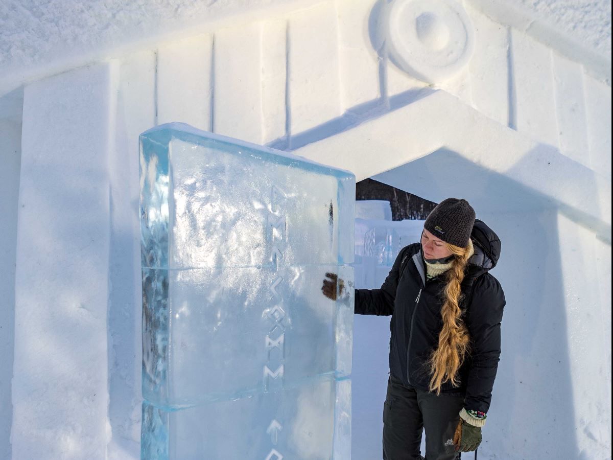 A guest opens a door made of ice
