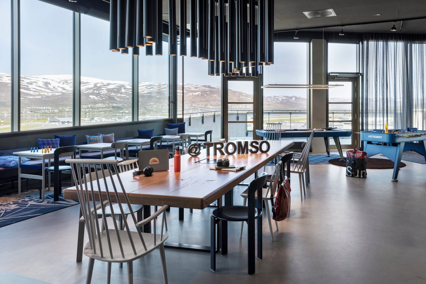 Reseption, common areas, games, breakfast, restaurant and bar in the top floor of Moxy. Views towards Kvaløya