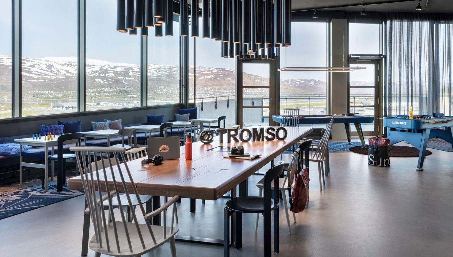 Reseption, common areas, games, breakfast, restaurant and bar in the top floor of Moxy. Views towards Kvaløya