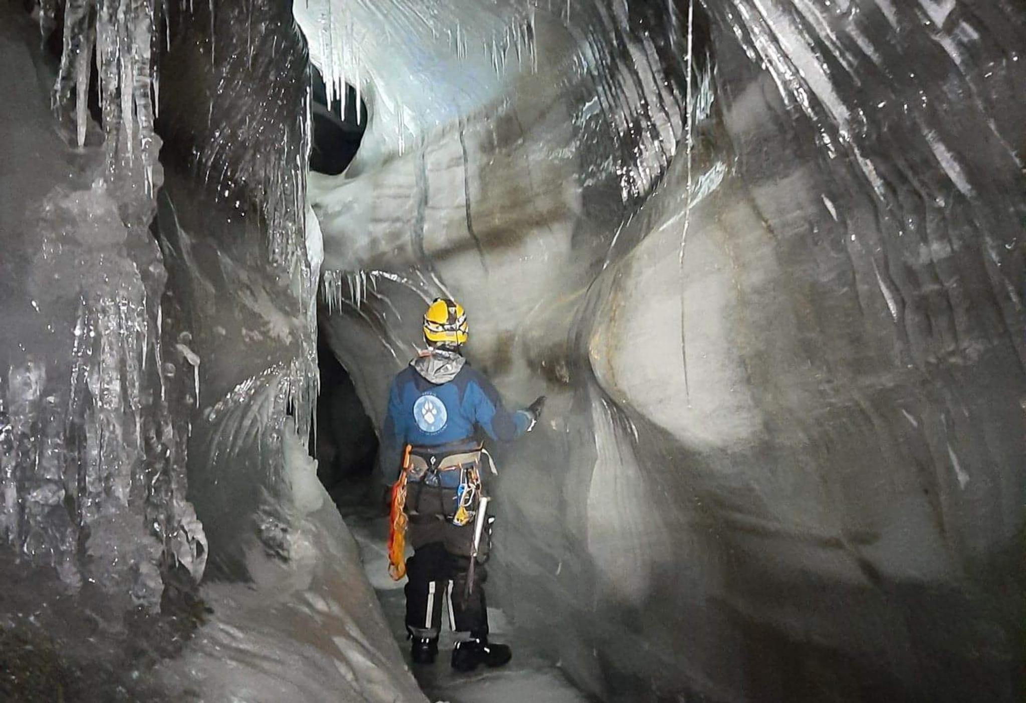 A person inside an ice cave