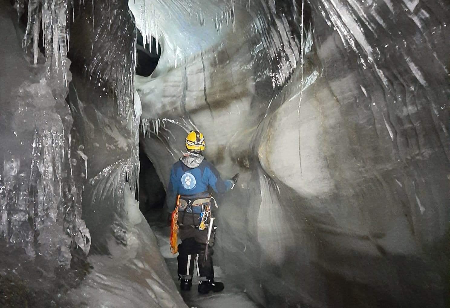 A person inside an ice cave