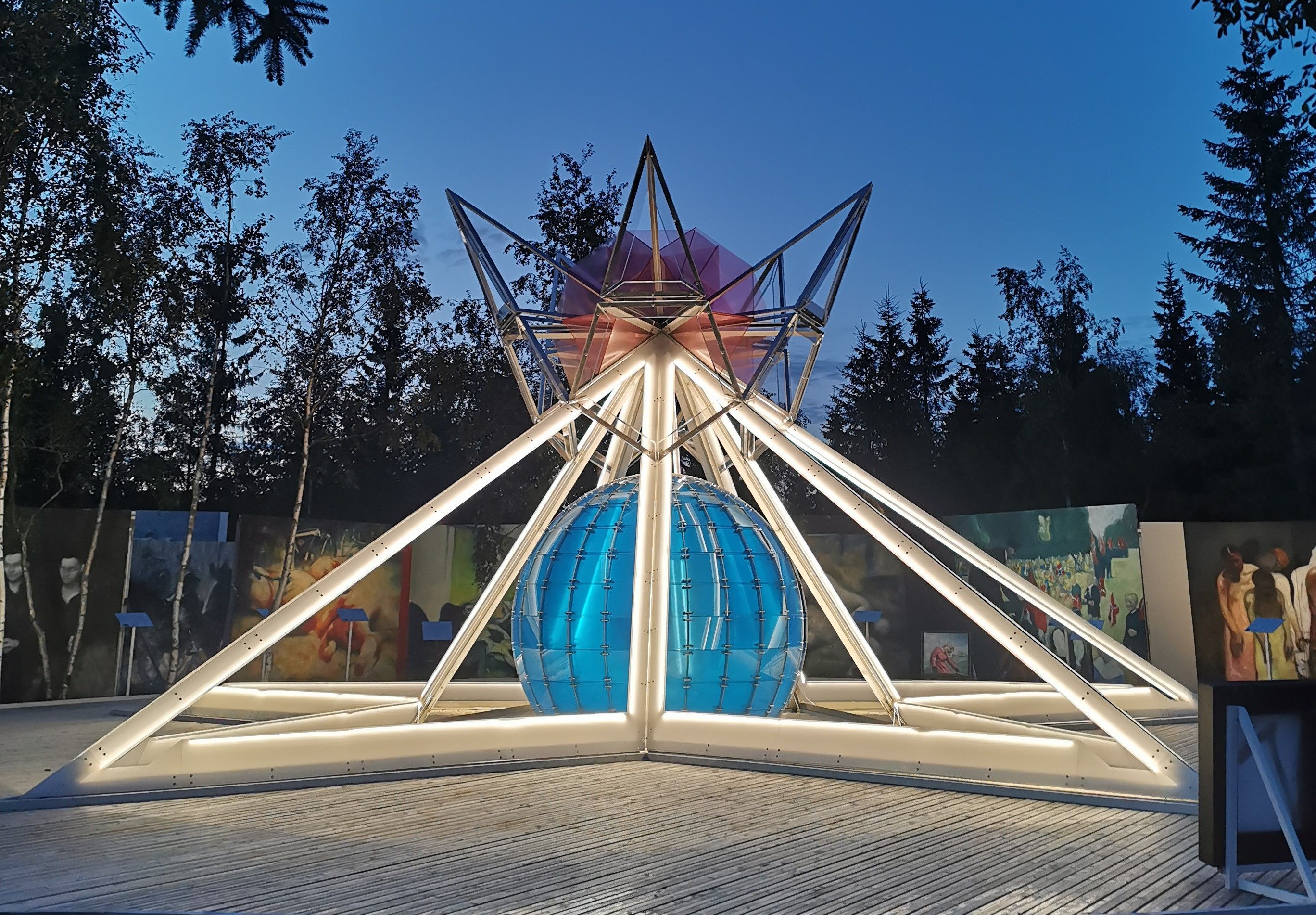 Abstract sculpture with trees in the background